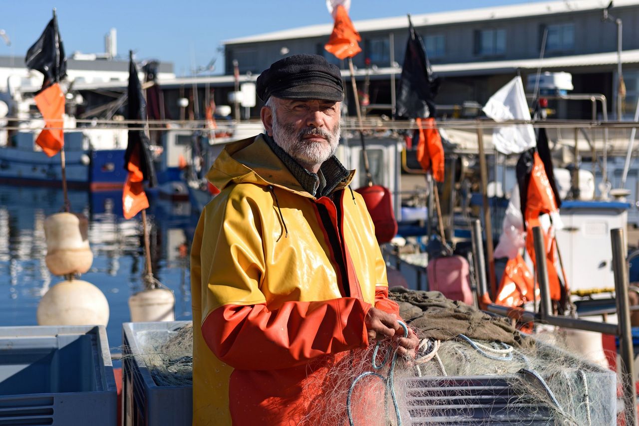 Portrait of a fisherman in the harbour.