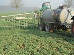 Slurry tanker with dribble bar system on a field
