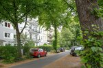 Street with parked cars in urban residential area