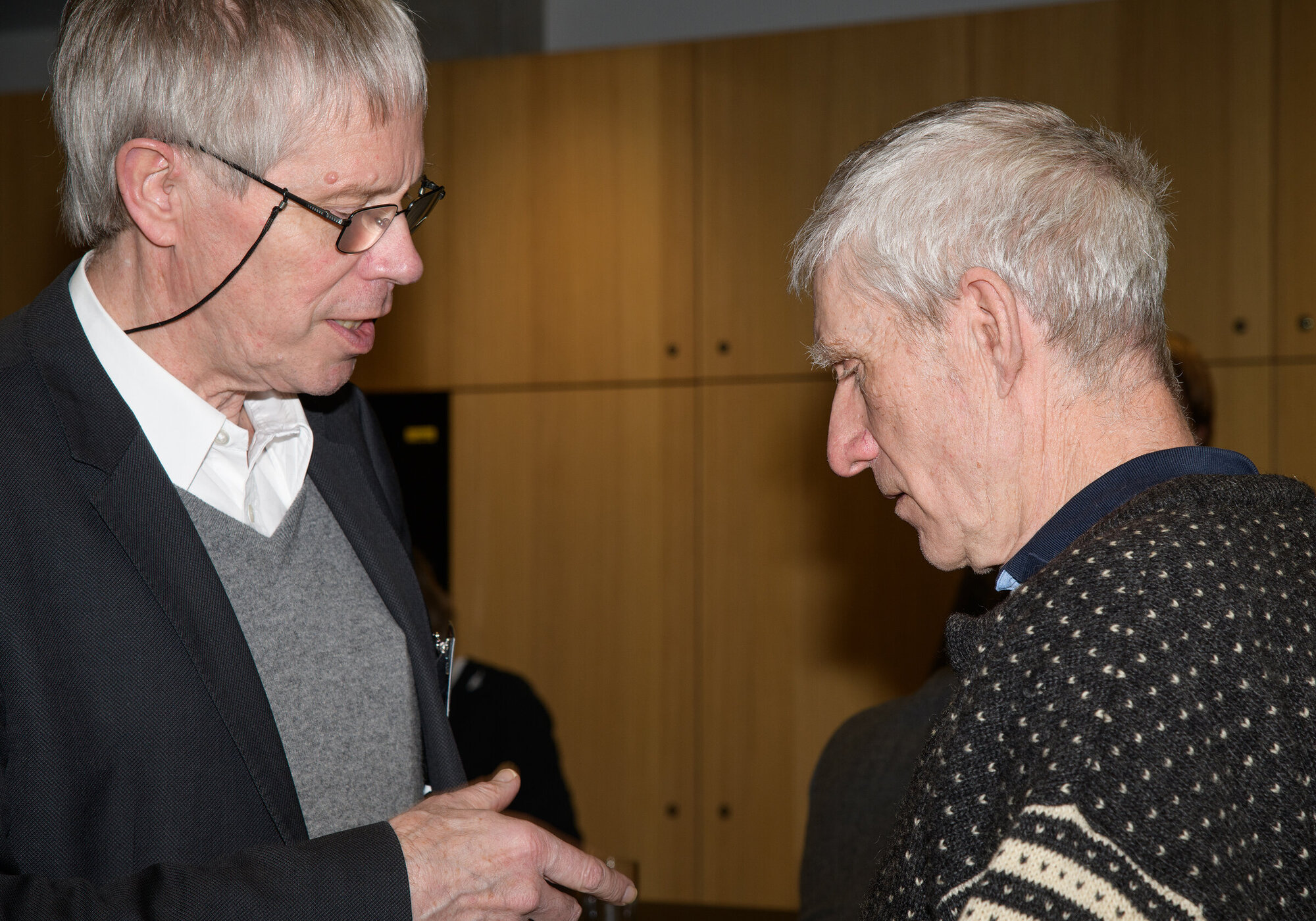 There were many lively discussions. Two people in conversation.