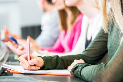 Students in a university's lecture hall write an exam