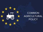 Flagge der Europäischen Union mit deinem Tecker in der Mitte der Sterne und rechts daneben die Beschriftung: "Common Agricultural Policy