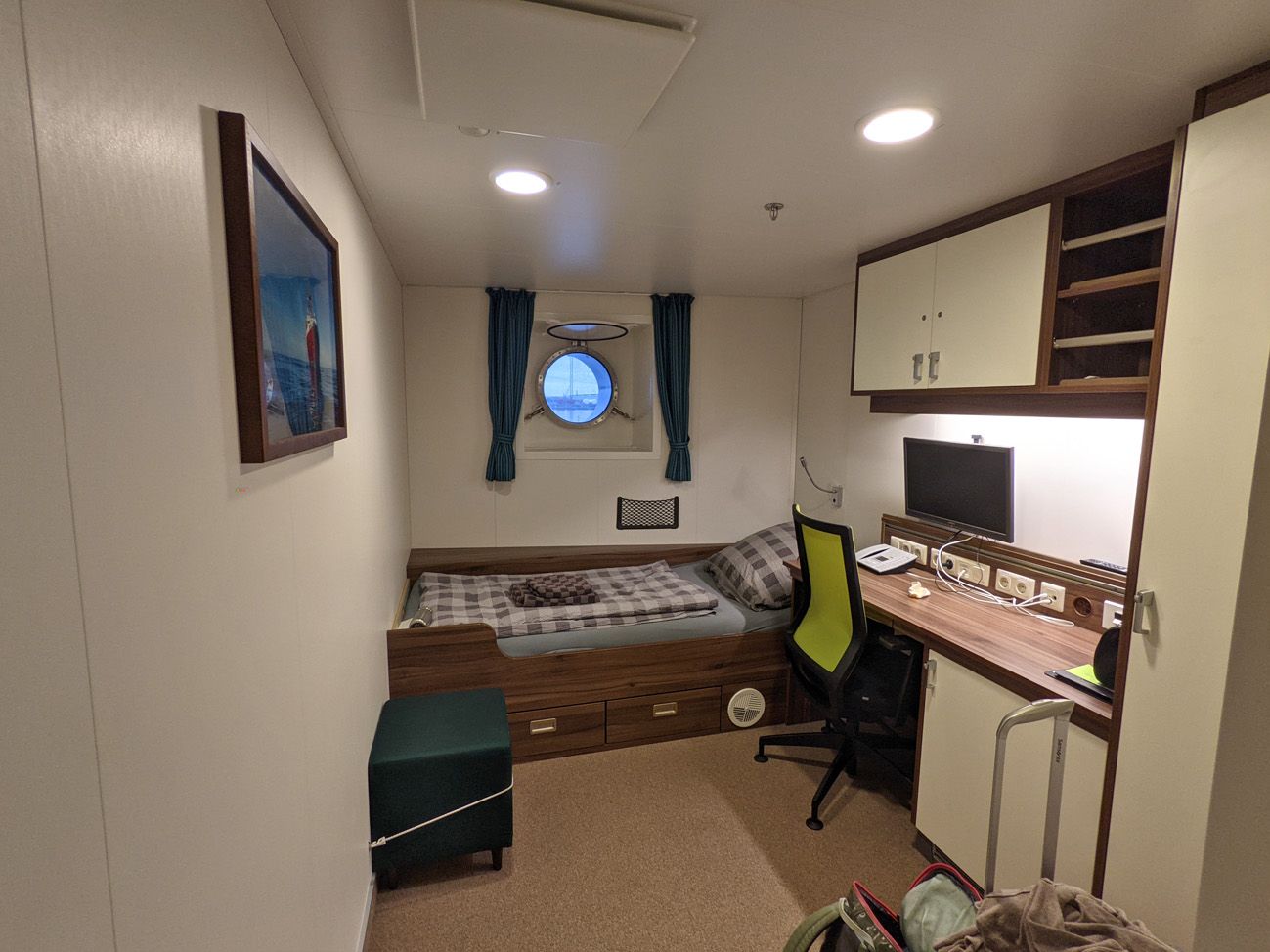 Each cabin has a bath, a bed and a desk.