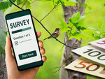 Collage: a hand holding a mobile phone displaying ‘Survey - Question 1 of 5’; a chaffinch in the forest and cut banknotes