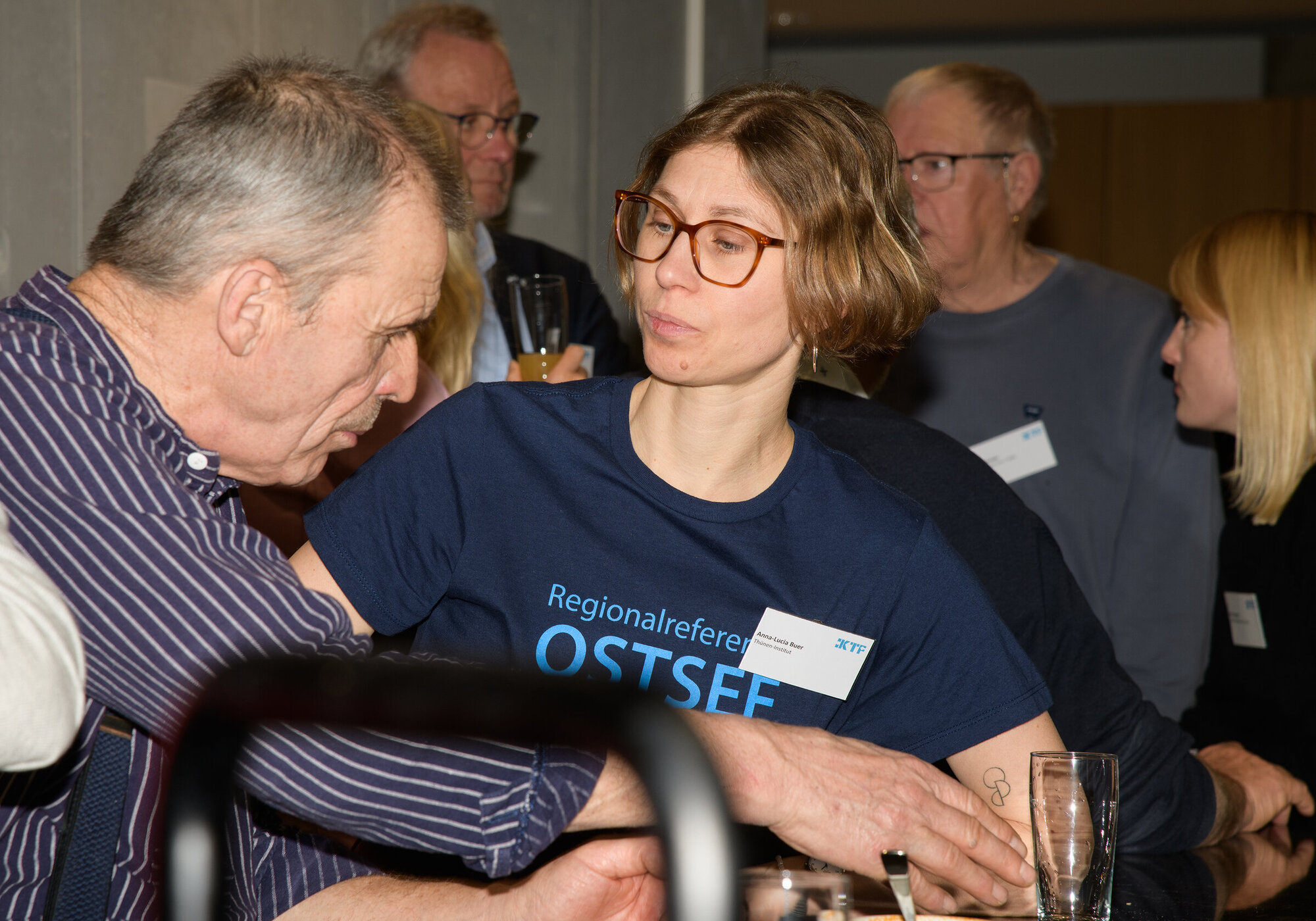 Discussion with the IKTF Regional Representative for the Baltic Sea. Several people in conversation.