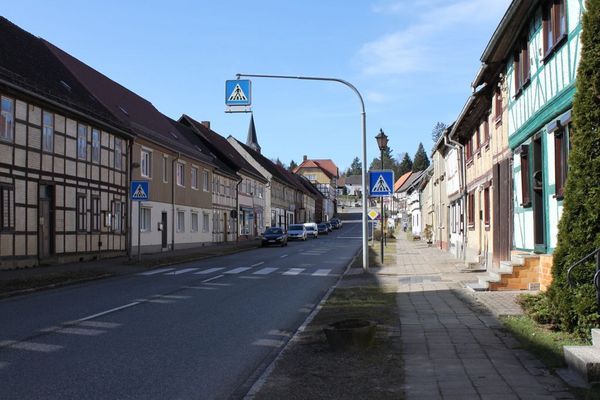 Street in a small town with rows of houses on both sides 