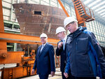 Federal President Frank-Walter Steinmeier (left) during a visit to Fassmer GmbH & Co. KG in Hall 290 at the Volkswerft shipyard as part of the "Ortszeit Deutschland" event.