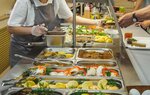 Cuisine Cafeteria Buffet with food. Self-service food display cabinet.