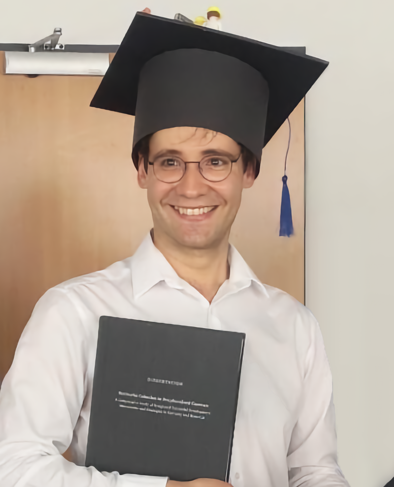 Portrait photo of Alexandru Brad with doctor's hat
