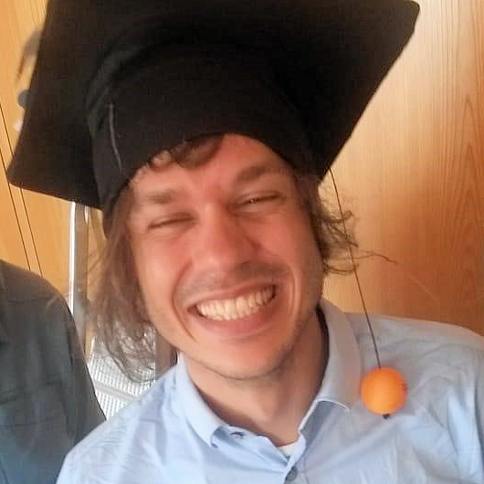 Florian Schneider with doctoral cap